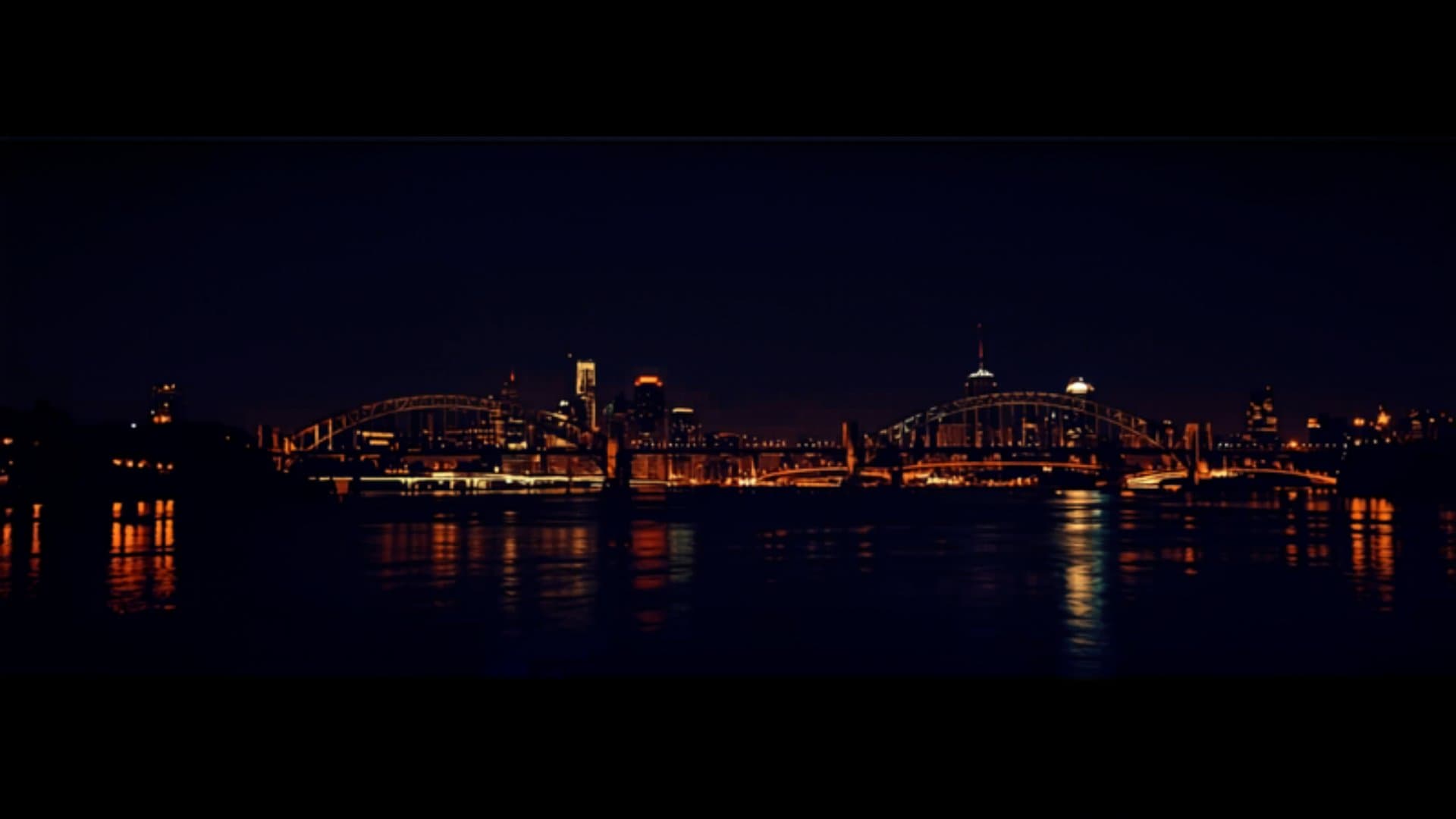 Portland Oregon skyline at night with bridges and Willamette River