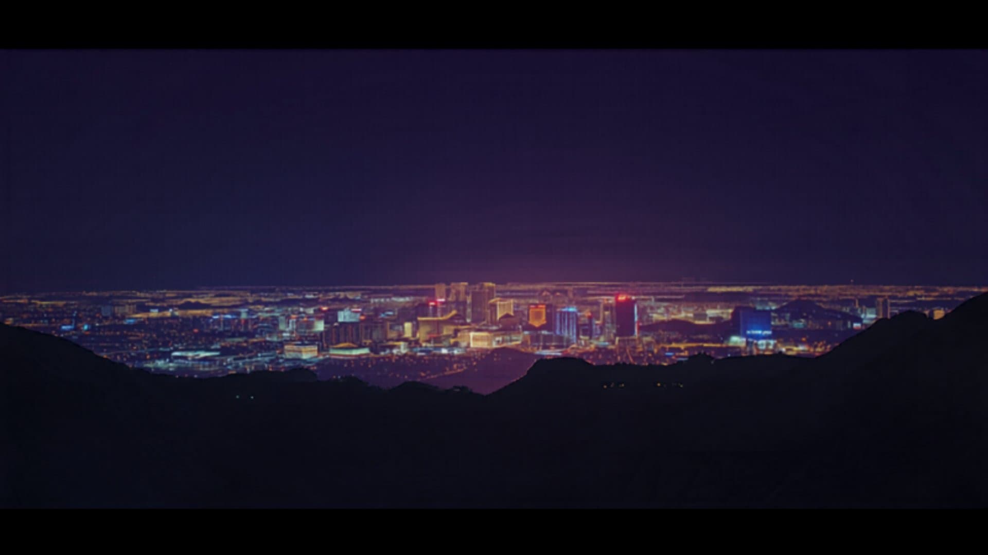Las Vegas Nevada skyline at night with city lights and desert landscape